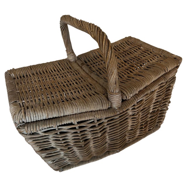 A wonderful Picnic Basket - Woven of heavy rattan - a center opening with duo sides for easy access. A spacious basket for...