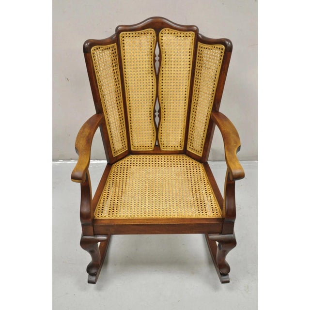 Antique Victorian Walnut and Cane Carved Rocker Rocking Chair w/ Queen Anne Legs. Circa Early 20th Century. Measurements:...