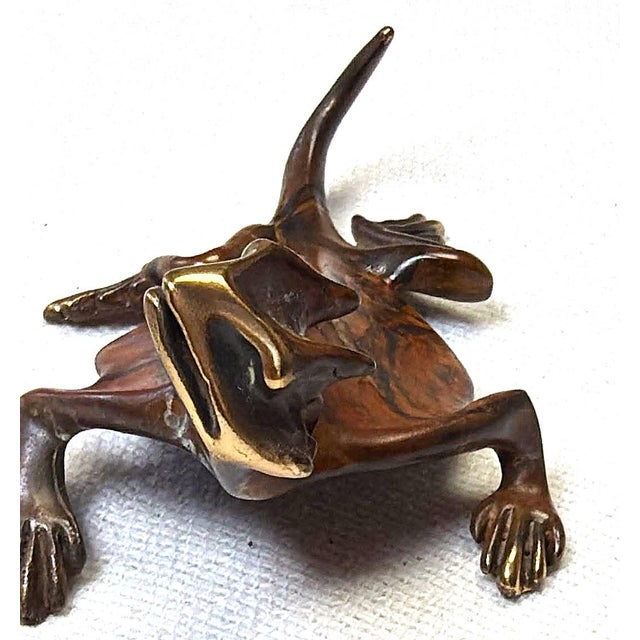 Michael Storey Artist/Signed Handcrafted bronze lizard sculpture features a striking marbled brown and tan patina with...