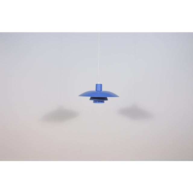 This pendant was designed by Poul Henningsen and produced by Louis Poulsen from 1966 until it was discontinued in this...
