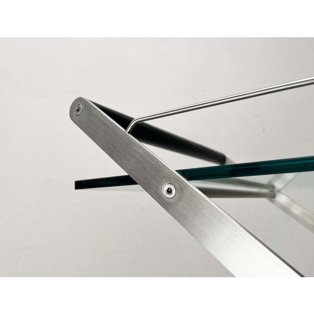 Elegant bar cart by the Italian manufacturer Gallotti & Radice, designed by Andreas Weber in the late 1990s. A delicate...