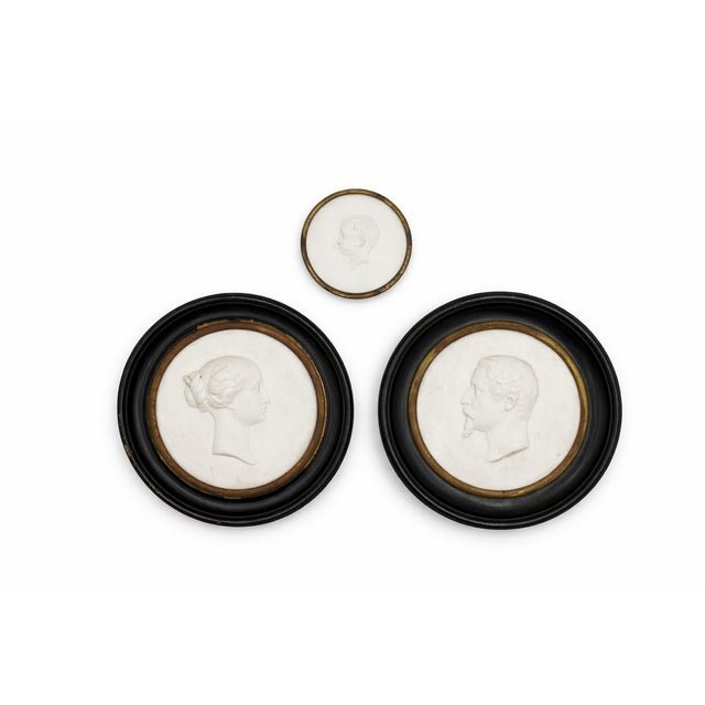 Details: -A distinguished set of three antique French plaster portrait medallions, 19th century -Each medallion features a...