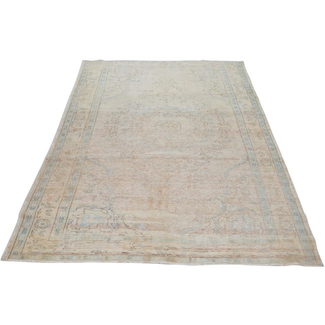Vintage Turkish Anatolian hand knotted rug with natural colors and fine weave.