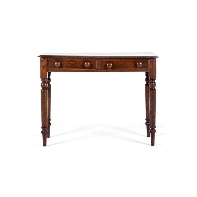A perfectly proportioned pine hall table with a pair of smooth running drawers. Each drawer is complemented with the...