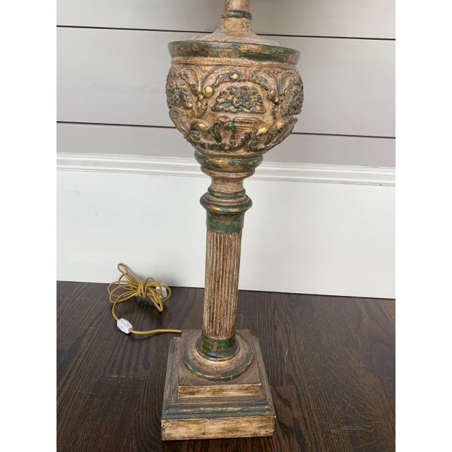 Vintage alter stick made into a lamp with added gold leaf detail.