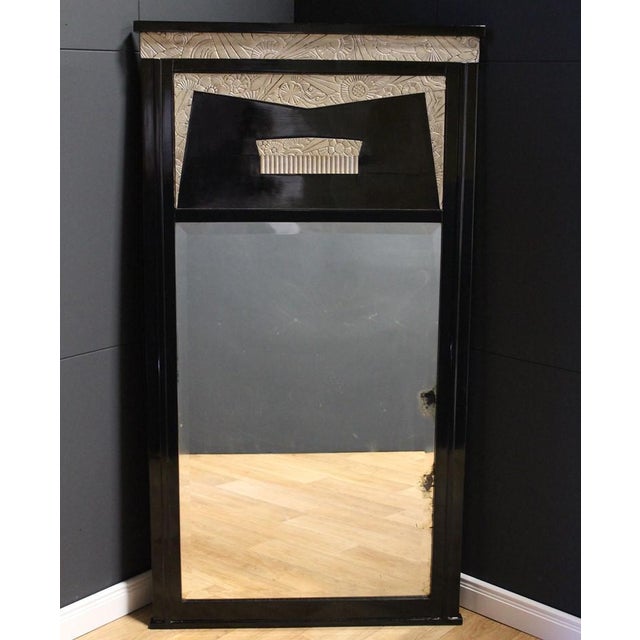 Art Deco mirror France around 1930. Original mirror glass. Black shellac with silver-plated stucco ornaments. Original...