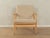 Classic armchair from the 1960s. High-quality solid ash wood frame. The armchair has been reupholstered and covered with a...