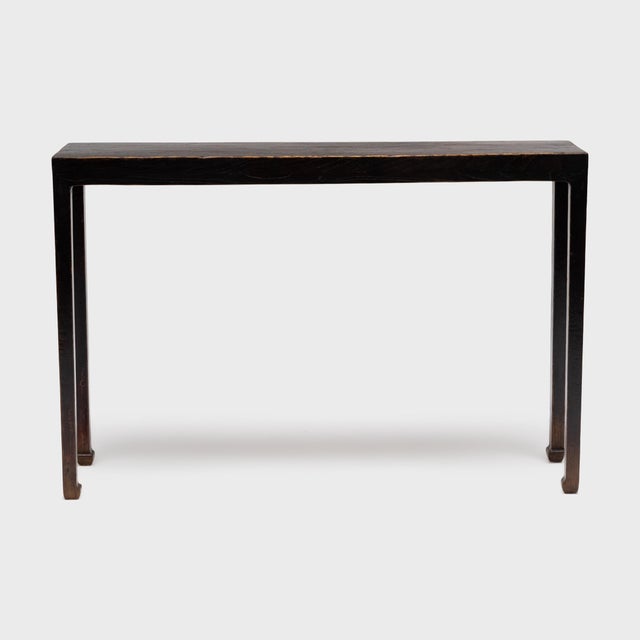 With clean lines and balanced proportions, this narrow console table recalls the austerity of Ming-dynasty furniture...