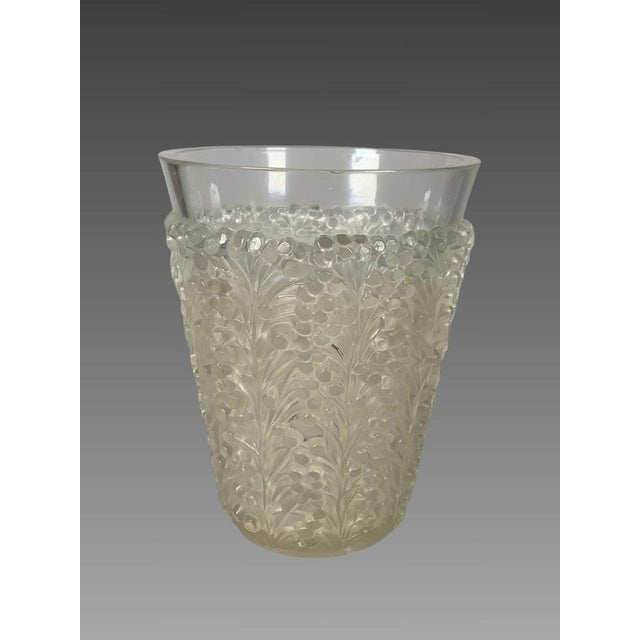Art Deco pressed glass vase signed René Lalique (1860-1945). "St. Tropez" model. Decorated with stylized mimosa trees in...