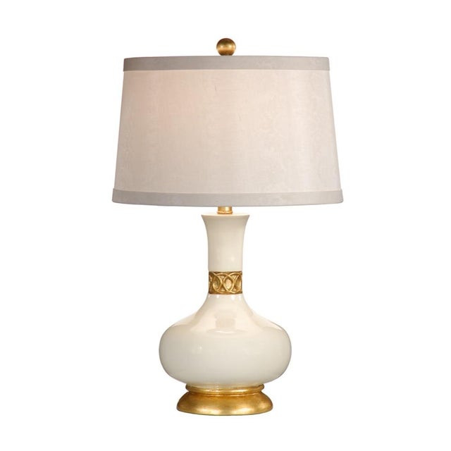 Bring elegance to your home with this hand decorated porcelain table lamp. The gardenia white glazed body features a...