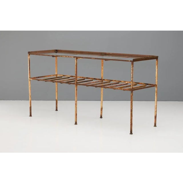 Two tier metal table with toughened glass top. Circa 1930.