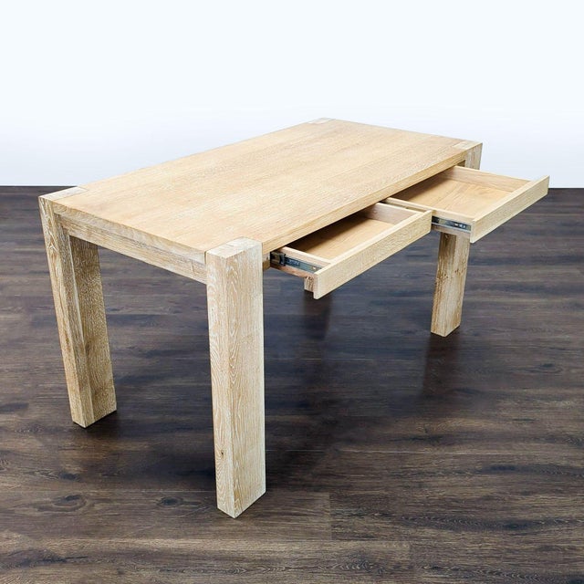 This sturdy Crate and Barrel desk features a clean, modern design with a light wood finish. It has two spacious drawers...