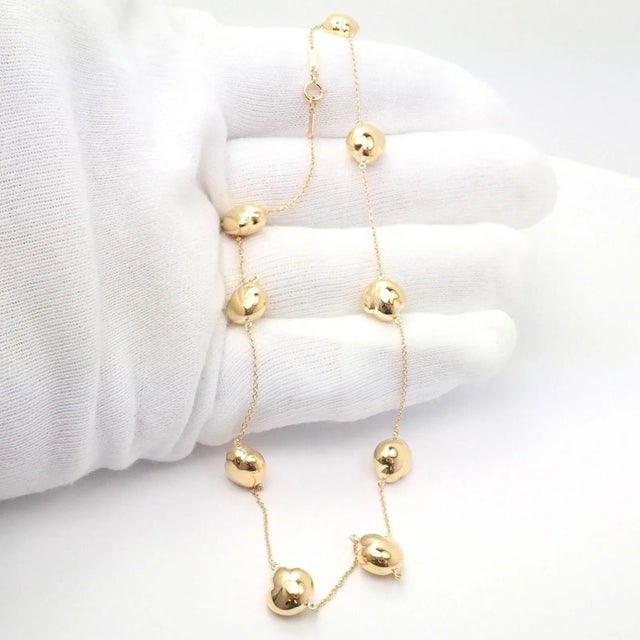 About This Piece: Metal: 18k Yellow Gold Chain Length:14.5" Weight: 18 grams Bean Size: 9mm Hallmarks: Tiffany&Co Peretti...