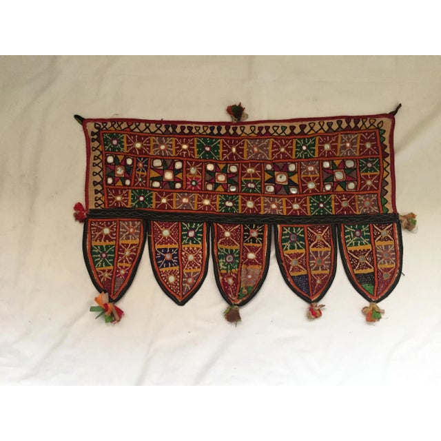 A vintage hand-embroidered mirrored cotton door or window valance with ribbon tassels. One of a kind. Purchased in Jaipur,...