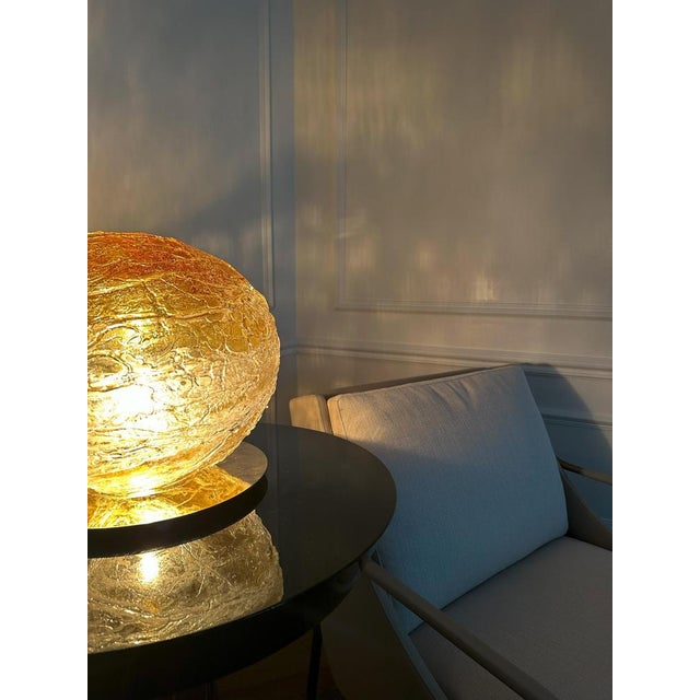 This venini primordiale table lamp, handcrafted in murano in 2011 and signed to the base, is a sculptural example of early...