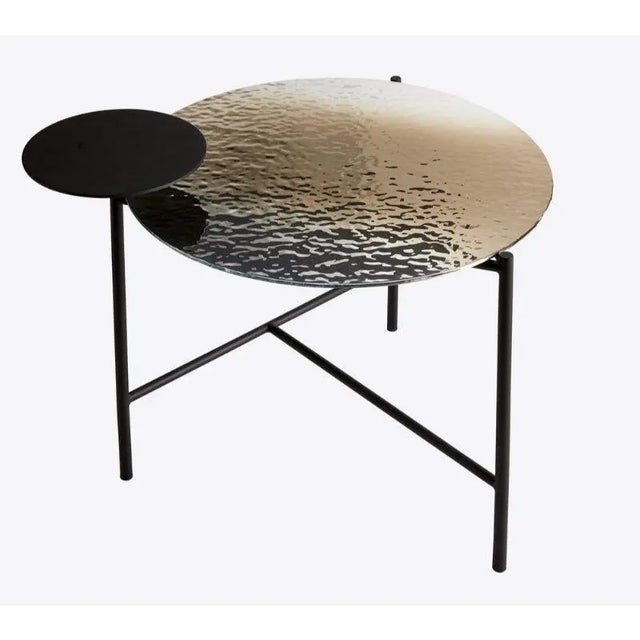 Mirage coffee table by RADAR Design: Bastien Taillard Materials: Rippled silver glass top, black matte metal frame....
