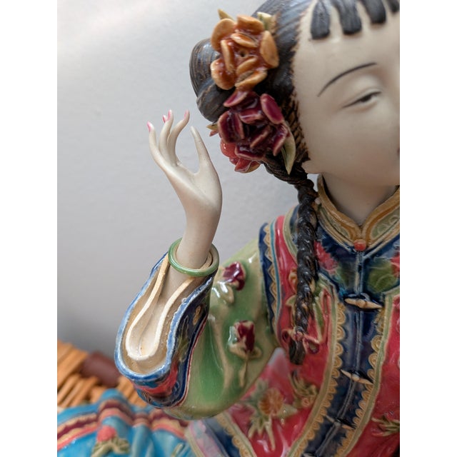 A vintage Shiwan Wucai Chinese Porcelain Figurine depicting a maiden or lady in a red robe accompanied by a white crane,...
