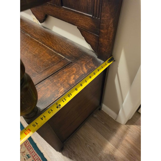 Wood Antique Oak Hall Bench Features Intricate Carvings and a Circular Cane Insert in the Backrest, Late 19th Century For Sale - Image 7 of 9