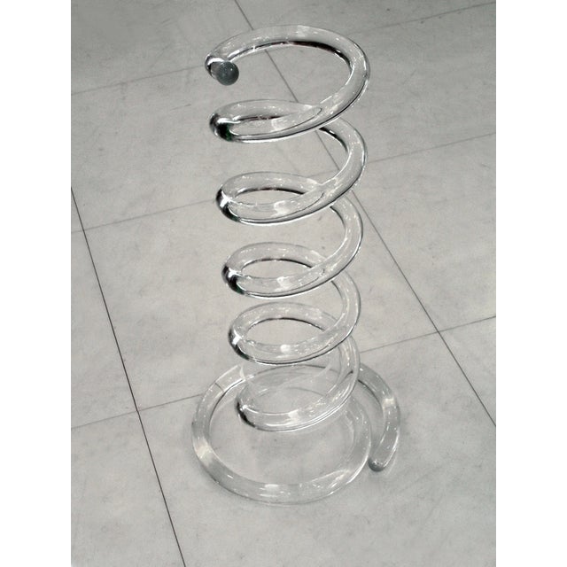 Dorothy Thorpe Umbrella Stand features a piece of spiral spring in clear Lucite. The original container is missing however...