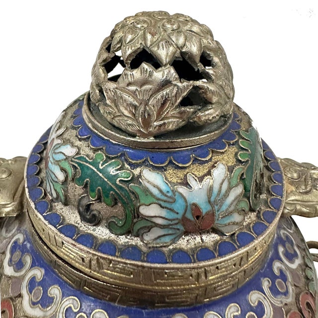 This is an antique Chinese cloisonné enamel tripod censer (incense burner) dating from the late Qing Dynasty to the early...
