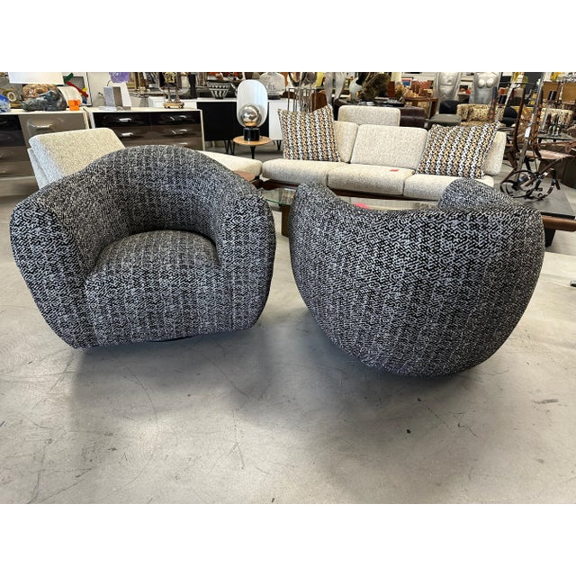 A running pair of oversized barrel swivel chairs from the 1980’s we’ve had totally redone in a beautiful cut velvet fabric...