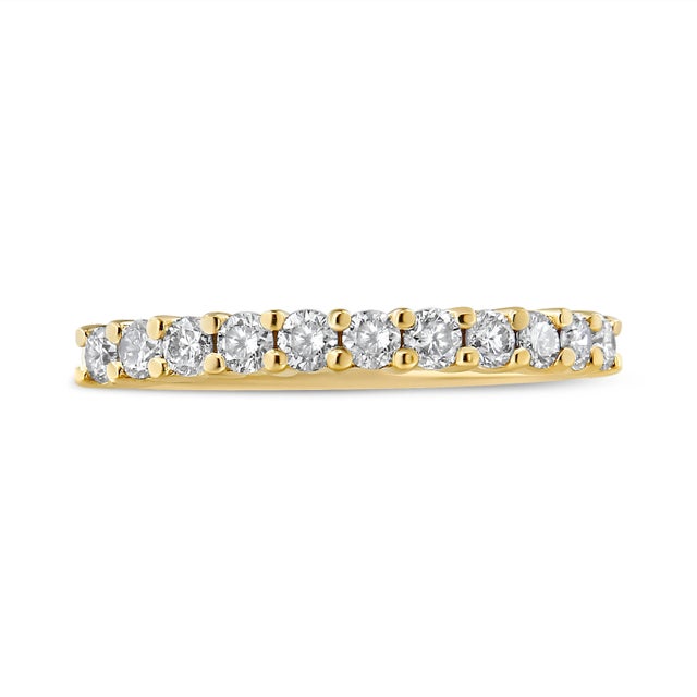 This classic and elegant 2 Micron 14K Yellow Gold Plated Sterling Silver band ring boasts a 1/2 carat of beautiful,...