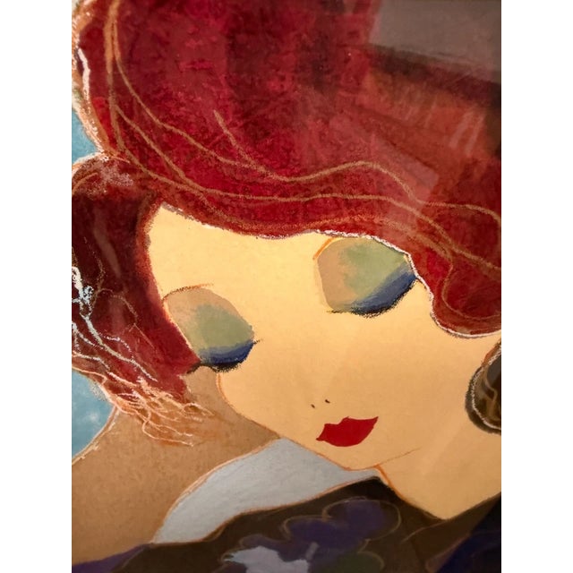 This is a serigraph titled "Contemplation" by the renowned artist Itzchak Tarkay (1935-2012 Israel). The piece depicts a...