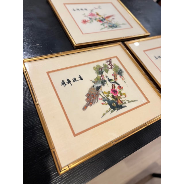 Offered is a vintage Asian themed framed piece of wall art. This needlepoint features gold leaf faux bamboo frame with an...