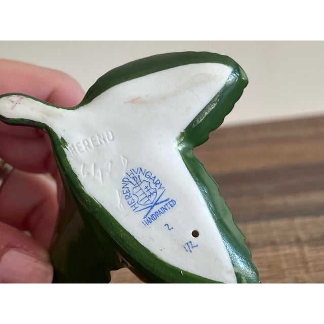 A vintage 1980s Herend porcelain spotted bunny on leaf figurine.