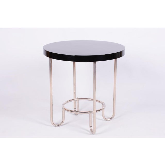 This elegant round Bauhaus style table comes from Czechoslovakia from the first half of the 20th century and was...