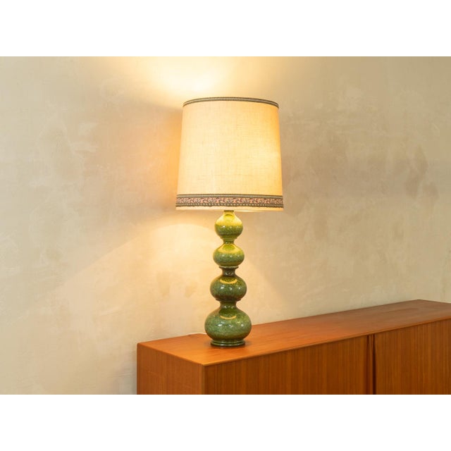Exclusive Bubble table lamp by Kaiser Leuchten from the 1960s. Handcrafted glazed ceramic base in shades of green with a...