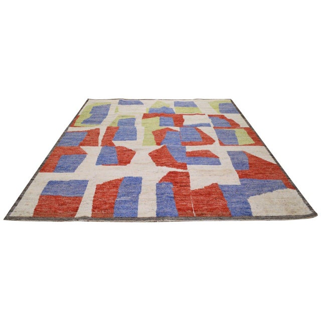 Hand-knotted with care using traditional rug-making techniques, this wool rug blends timeless craftsmanship with a modern...