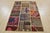An authentic vintage patchwork rug, hand-knotted with wool and has a cotton backing. This oriental rug features pieces of...