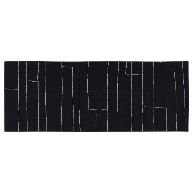 Hand-knotted with care using traditional rug-making techniques, this wool rug blends timeless craftsmanship with a modern...