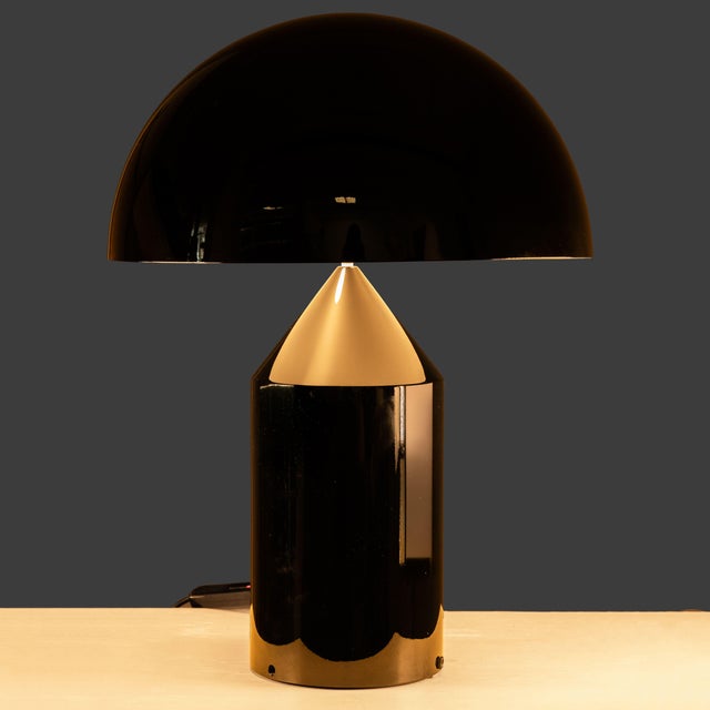 Black Atollo Table Lamp by Vico Magistretti for Oluce, 1979, in Good conditions. Designed 1970 to 1979 This piece has an...