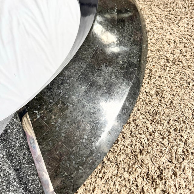 Bold and architectural, this Art Deco inspired tessellated stone mirror makes a striking statement with its sculptural...