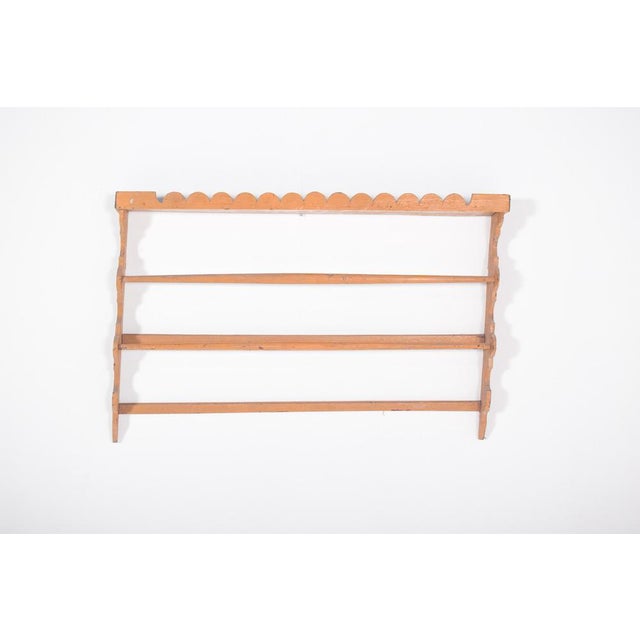 This rustic plate rack, crafted in wood and painted in a warm toasted yellow, radiates simplicity and charm. Its design is...