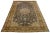This beautifully handcrafted Persian Tabriz wool rug displays a classic floral pattern. The blue background's contrast...