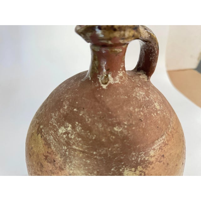 Jug or pitcher in Stoneware, with an exceptional patina. It's color with brown and Grey gives very pleasant contrasts....