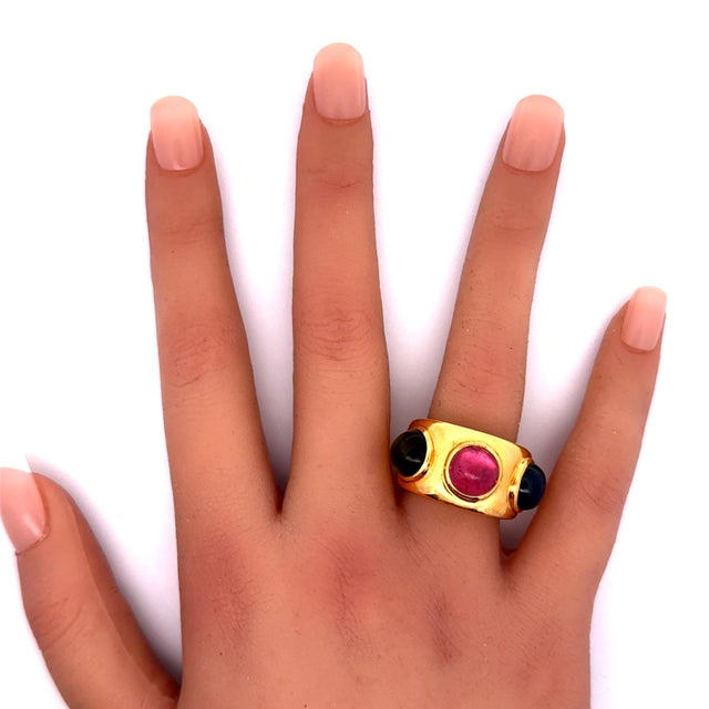 A bold fashion ring by Parisian designer Dominique Aurentis featuring a pink and green tourmaline weight a total of 4.00...