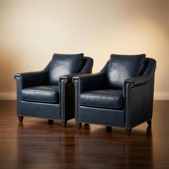 This pair of armchairs brings timeless elegance and comfort to any interior. Upholstered in rich Chateau Blue leather,...