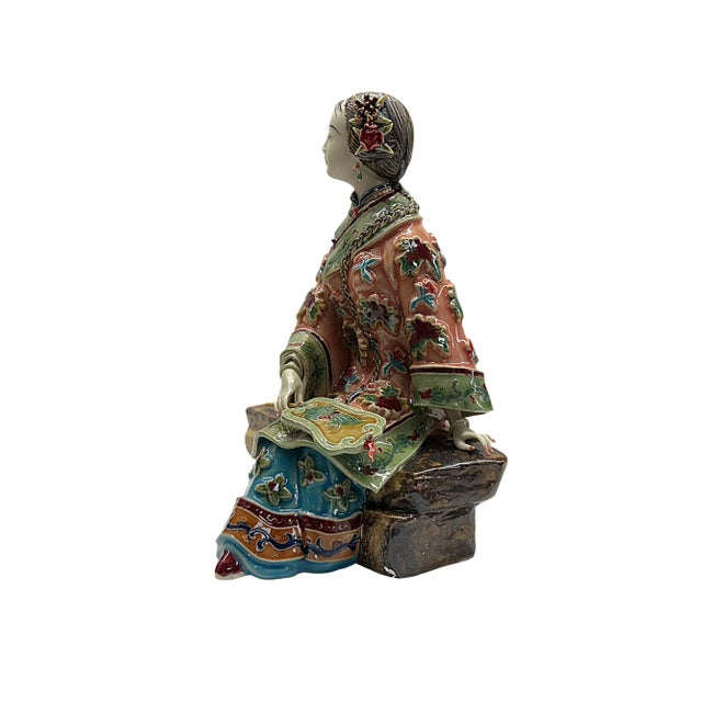 This exquisite, handcrafted porcelain figurine captures the serene beauty and grace of a Qing-style lady. Delicately...