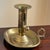 Offering an antique English-style brass chamberstick. This beautiful, handcrafted piece is made of solid brass and...