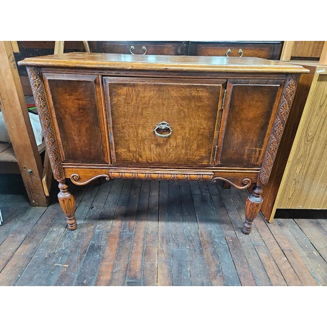 Beautiful vintage Jacobean Revival server cabinet, crafted by the highly regarded Tomlinson Chair Manufacturing Company....