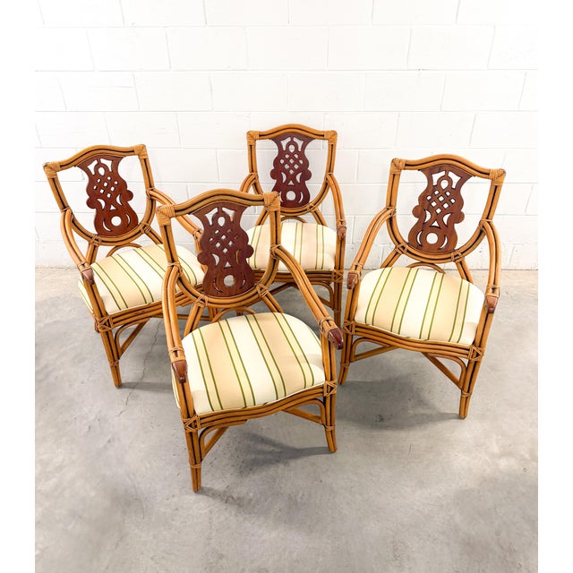 Set of 4 vintage coastal bamboo armchairs in the sought-after Palm Beach style. Crafted by P.T. Fendi Furindo. Made from...