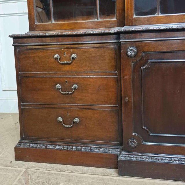 Wonderful English 18th C mahogany astragal glazed bookcase with carved decoartion, really good colour. 1790 This piece is...