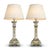 Pair of French faience table lamps dating to circa 1900–1910, with hand-painted Rouen-style floral and scroll decoration....