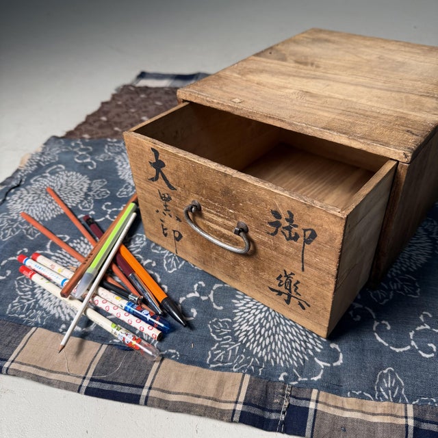 Charming wooden medicine box from Japan, once used as a small home pharmacy. Dimensions: height 13 cm, width 21.5 cm,...