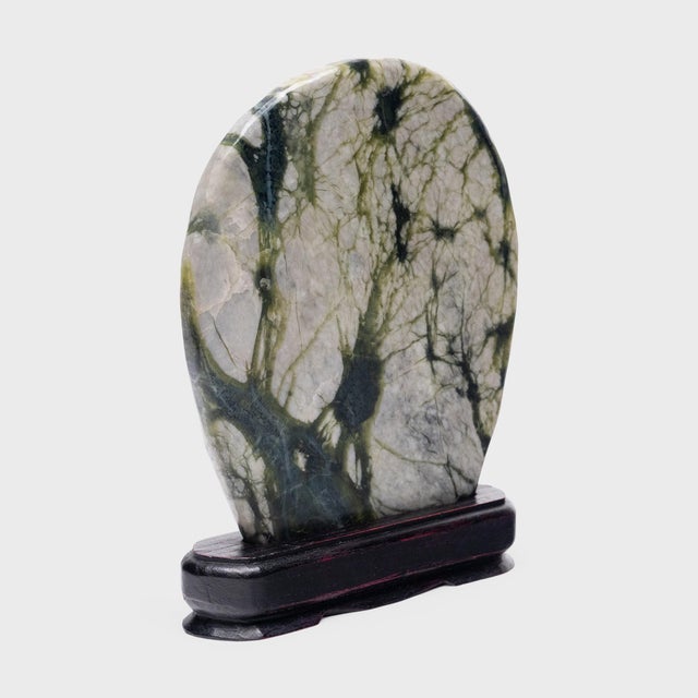 A well-chosen stone is a resting place for the mind, inspiring calm and contemplation. Marked by currents of jadeite, moss...