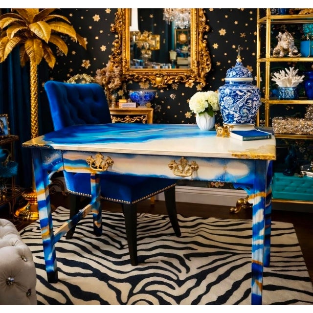 This is a vintage, mahogany desk that has been hand-painted in a geode-inspired crystal design with tones of blue, gold...